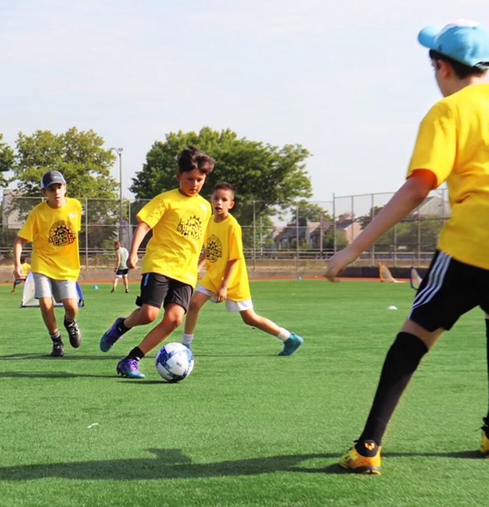 Players from our summer camp are engaging in a scrimmage.