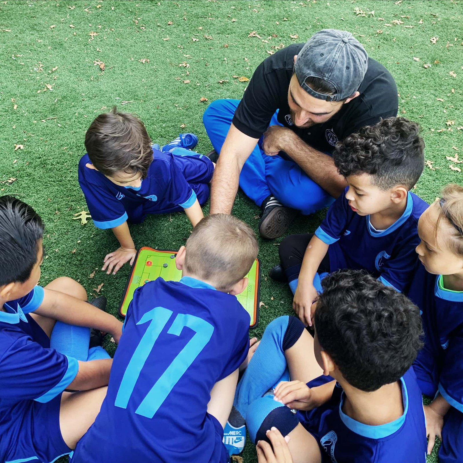 Internal League (Smart Kids) players engaging in a tactical discussion prior to their match that evening