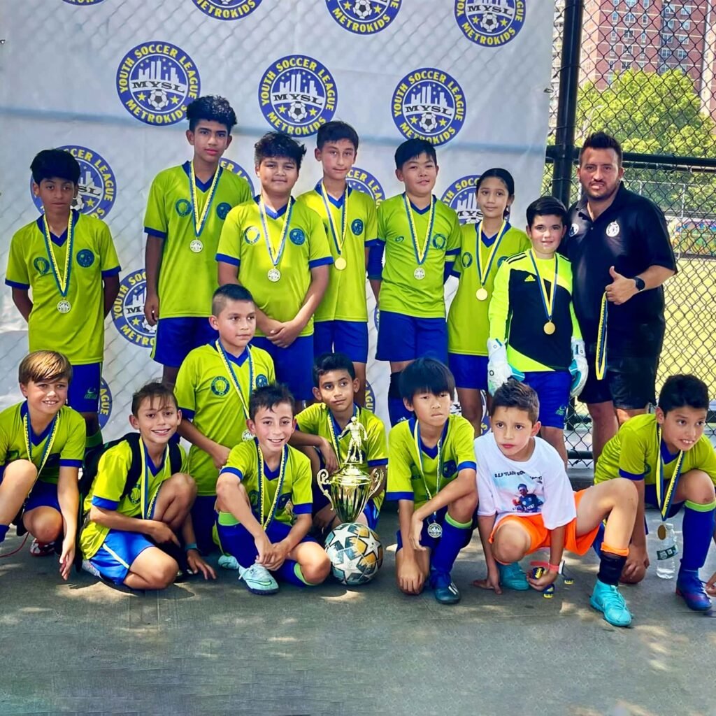 The U10 Travel posing for a group picture after coming in first place at a local tournament